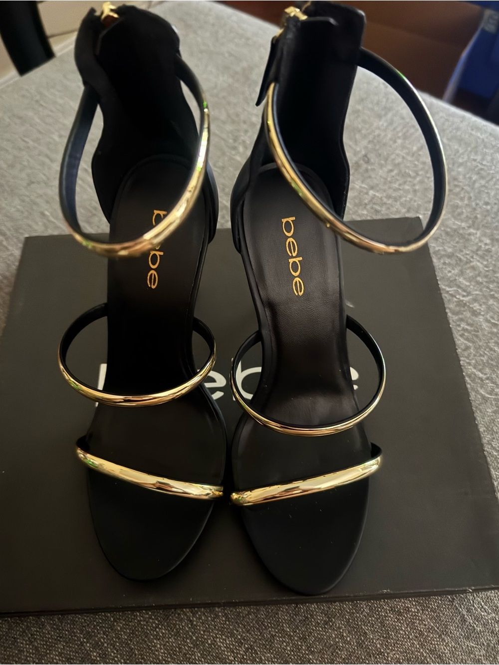 bebe Black and Gold Strappy Stiletto Sandals